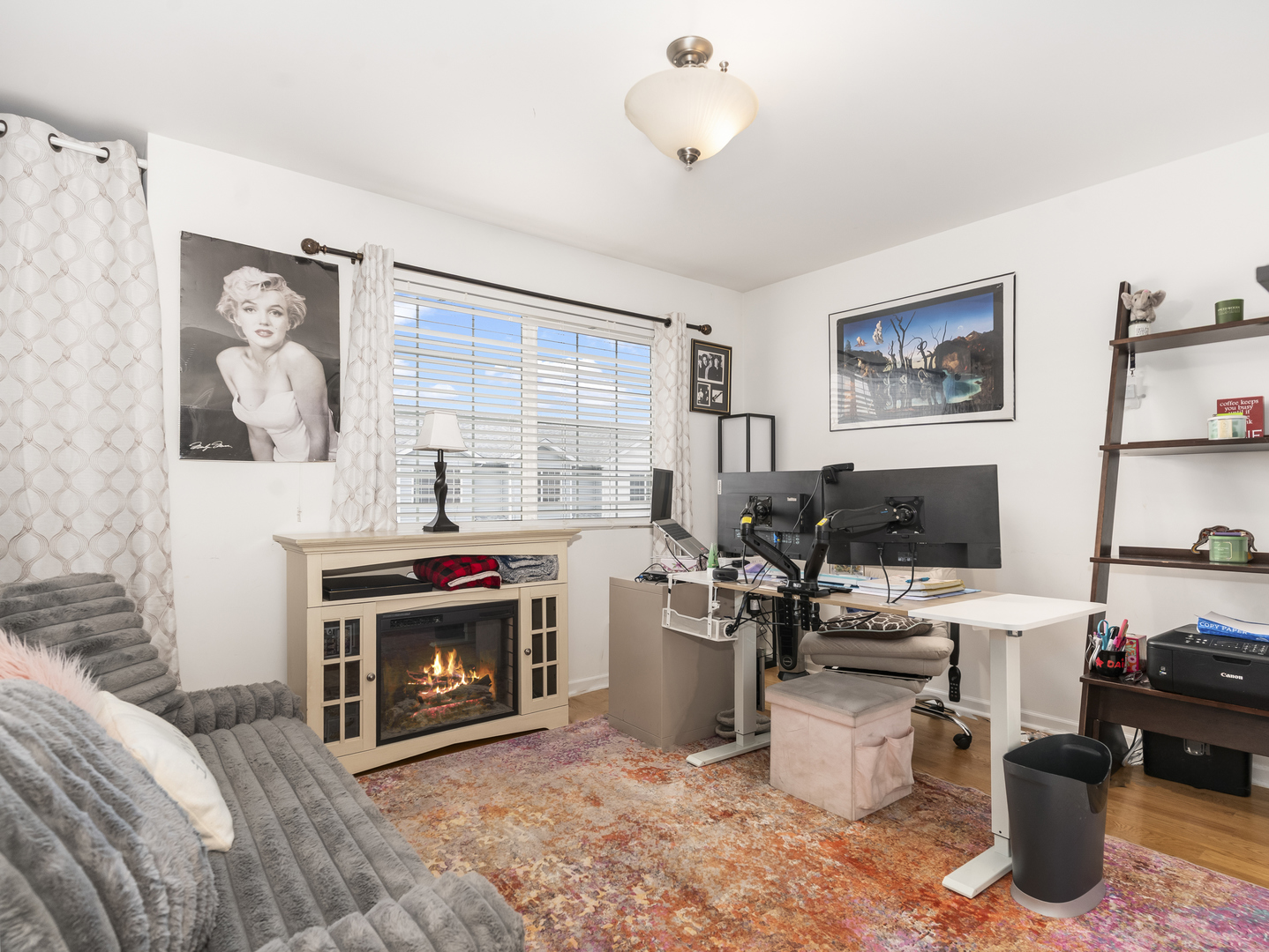 1923 Waters Edge Drive Minooka, IL 60447 - Photo 16 of 24 a living room with furniture a fireplace and a flat screen tv