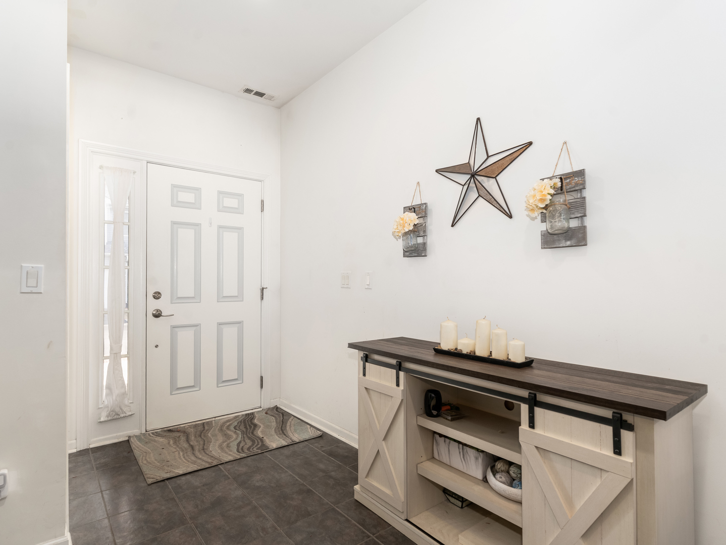 1923 Waters Edge Drive Minooka, IL 60447 - Photo 6 of 24 a view of storage and utility room with racks on the wall
