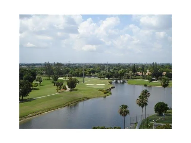a view of a lake with a yard
