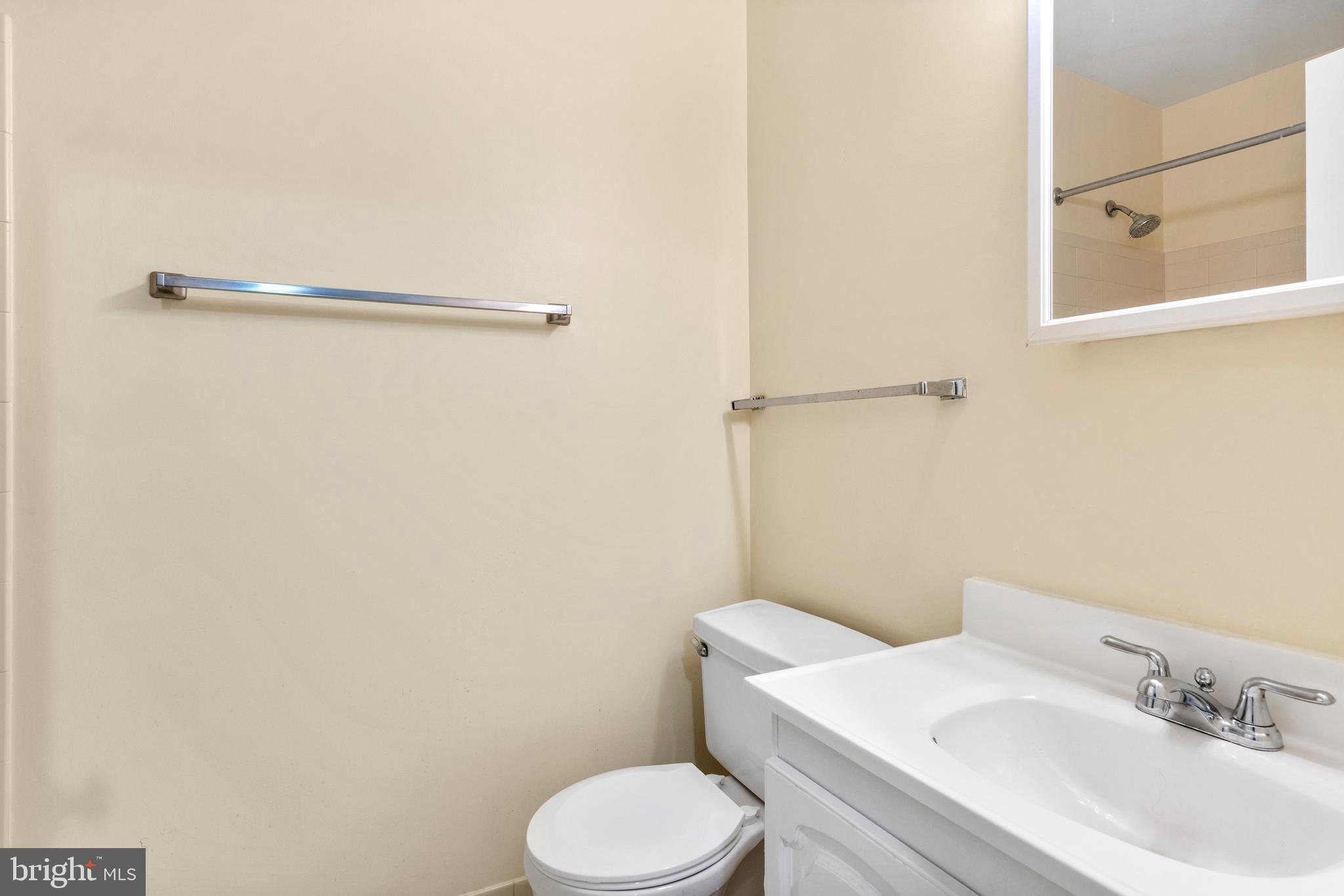 411 West Conestoga Road, Unit 18 Devon, PA 19333 - Photo 11 of 17 a white toilet sitting next to a bathroom sink