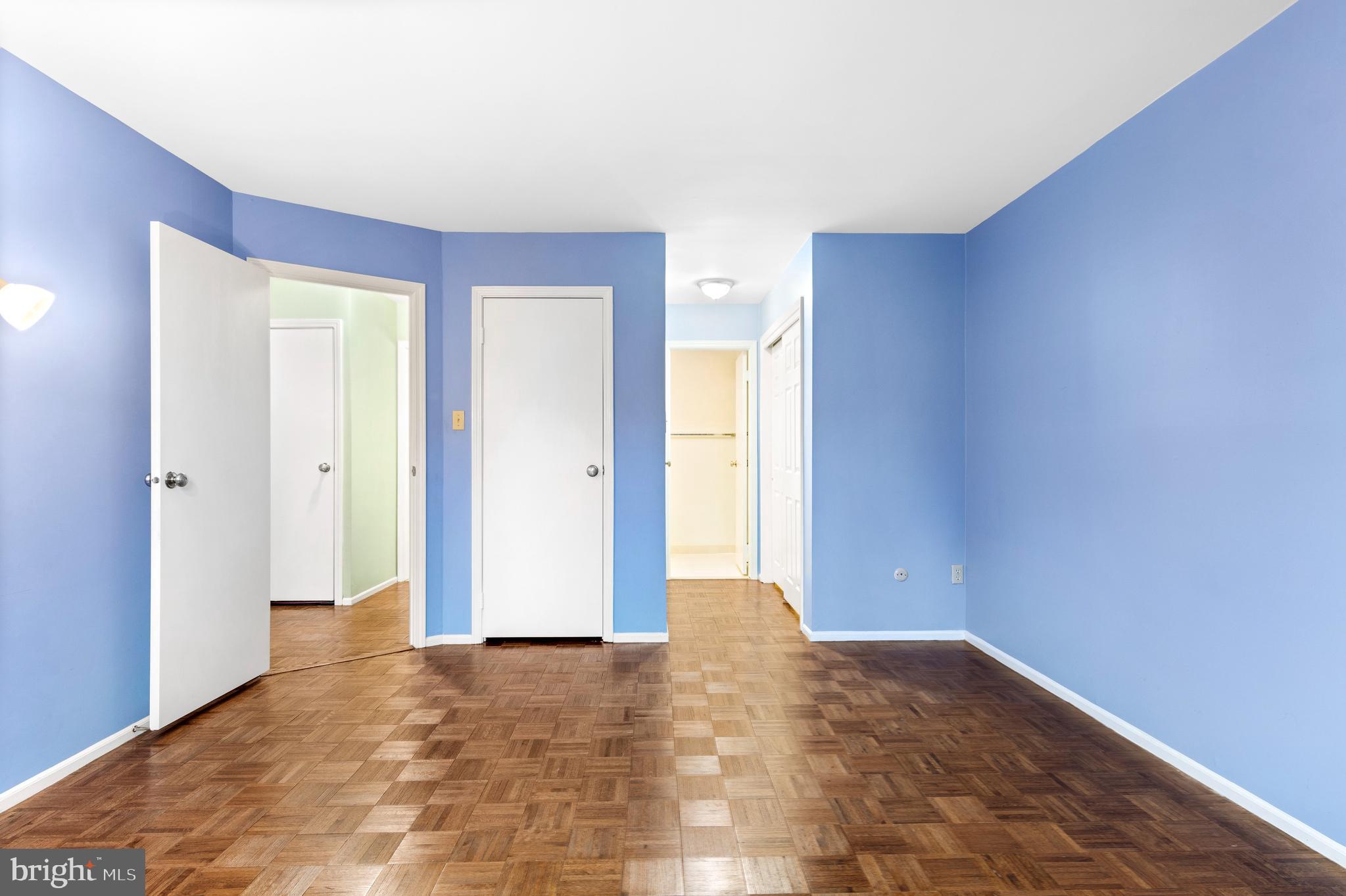 411 West Conestoga Road, Unit 18 Devon, PA 19333 - Photo 7 of 17 a view of an empty room with wooden floor