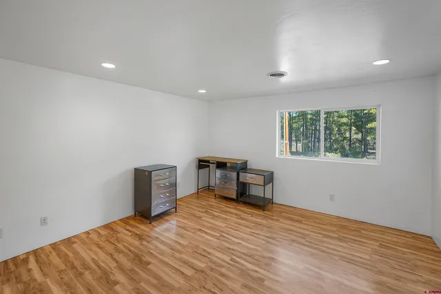 a view of a livingroom with a workspace