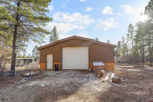 a backyard of a house with yard and outdoor seating
