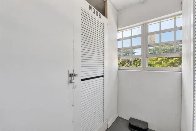 a view of front door with wooden floor