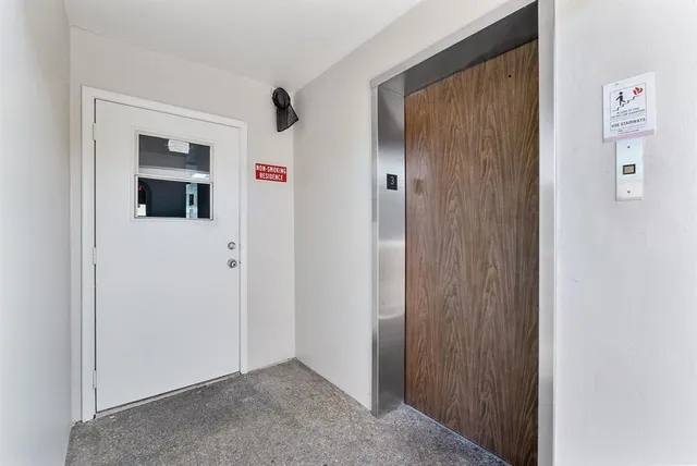 a view of a hallway with closet