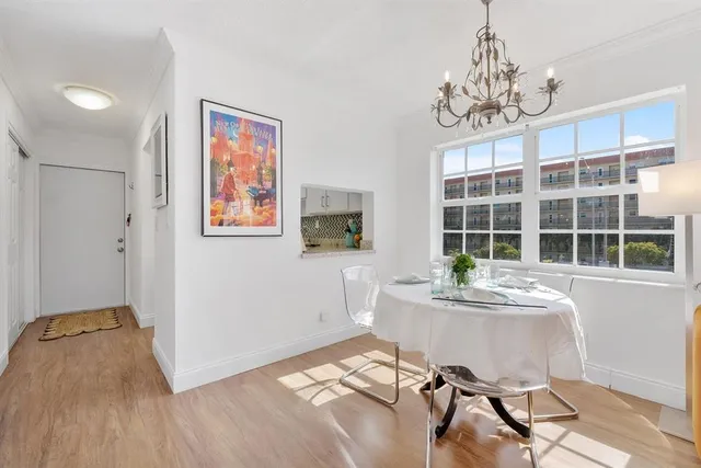 a workspace with furniture window and wooden floor