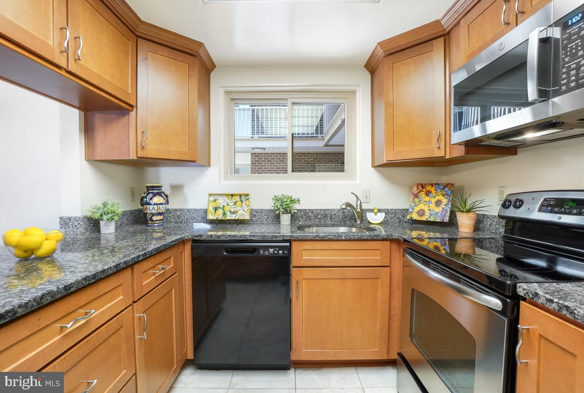 3346 Chiswick Court, Unit 581B Silver Spring, MD 20906 - Photo 1 of 49 Remodeled Kitchen with Granite Countertops