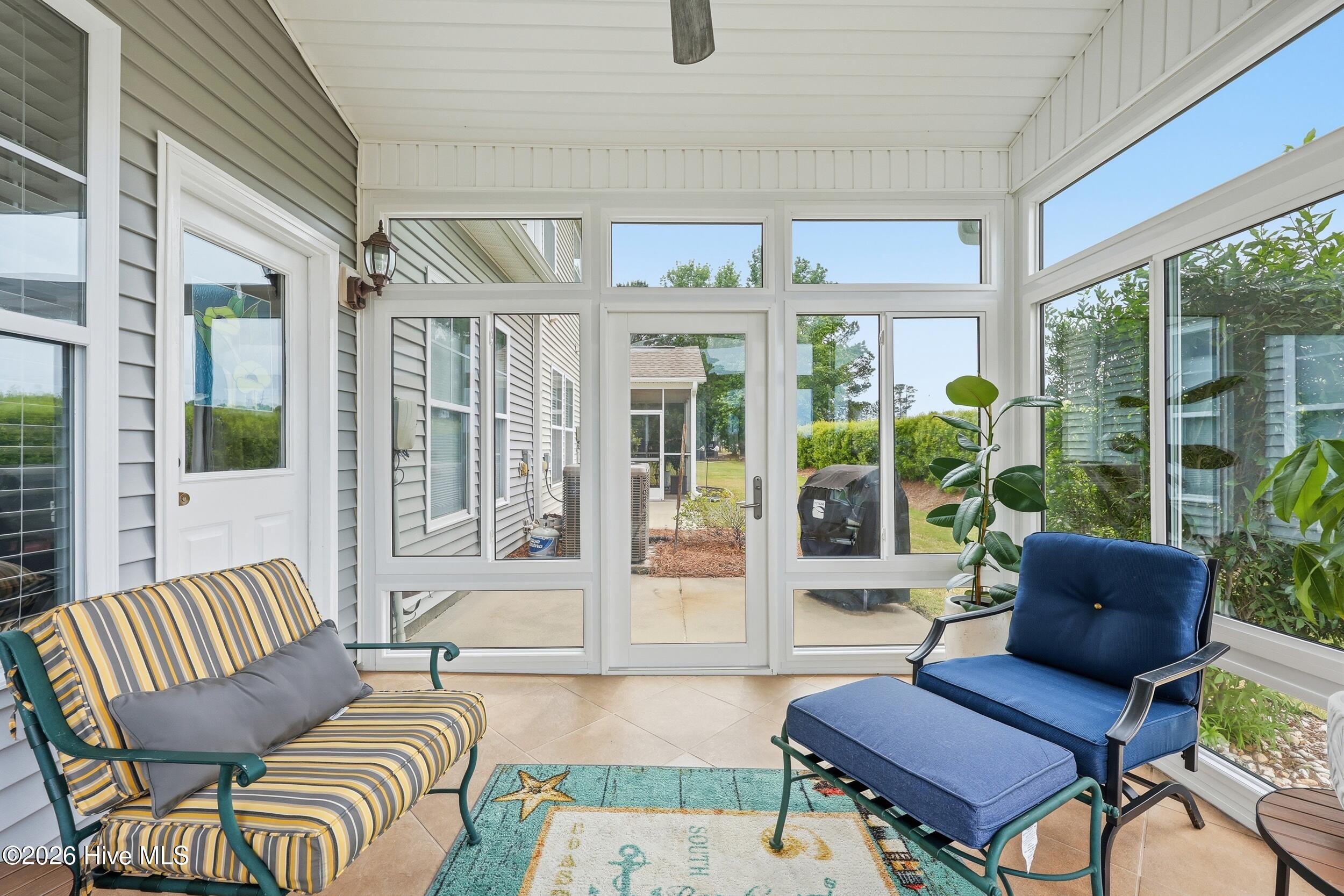 116 Freeboard Lane Calabash, NC 28467 - Photo 33 of 44 Large Sunroom with vaulted ceiling and windows