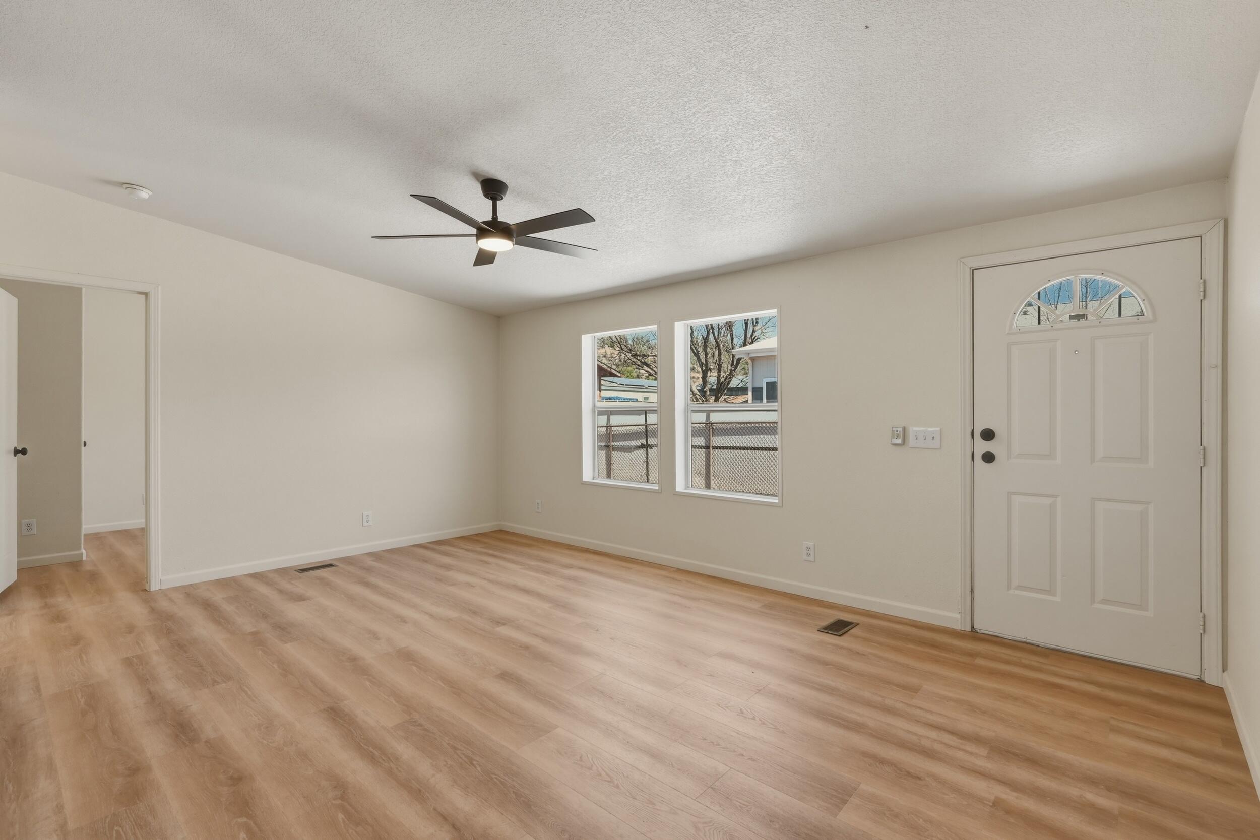 312 East Cedar Milll Road Star Valley, AZ 85541 - Photo 14 of 27 wooden floor in an empty room with a window