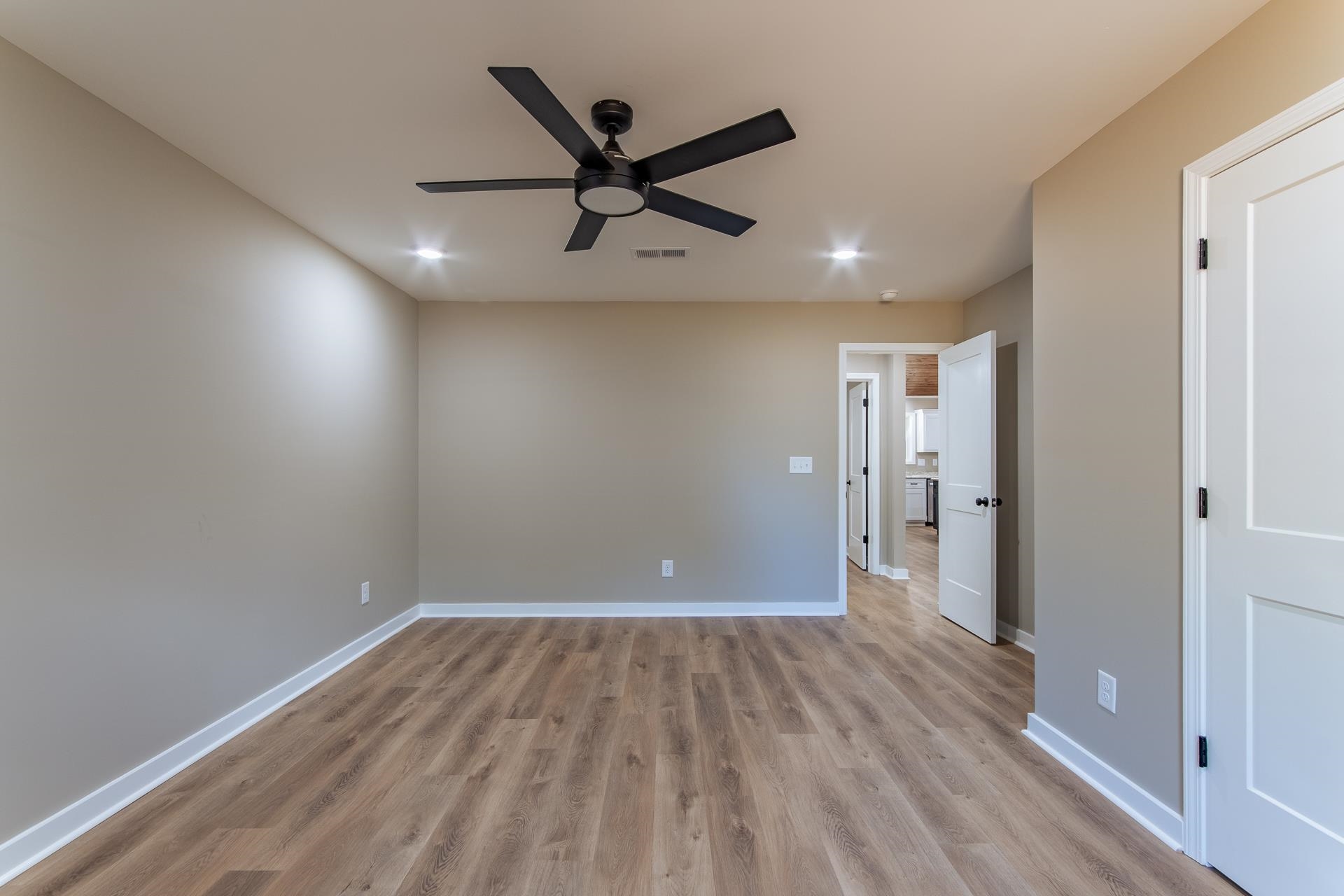 1471 Chambers Store Road Michie, TN 38357 - Photo 28 of 38 Unfurnished room featuring baseboards, visible vents, ceiling fan, and light wood-type flooring