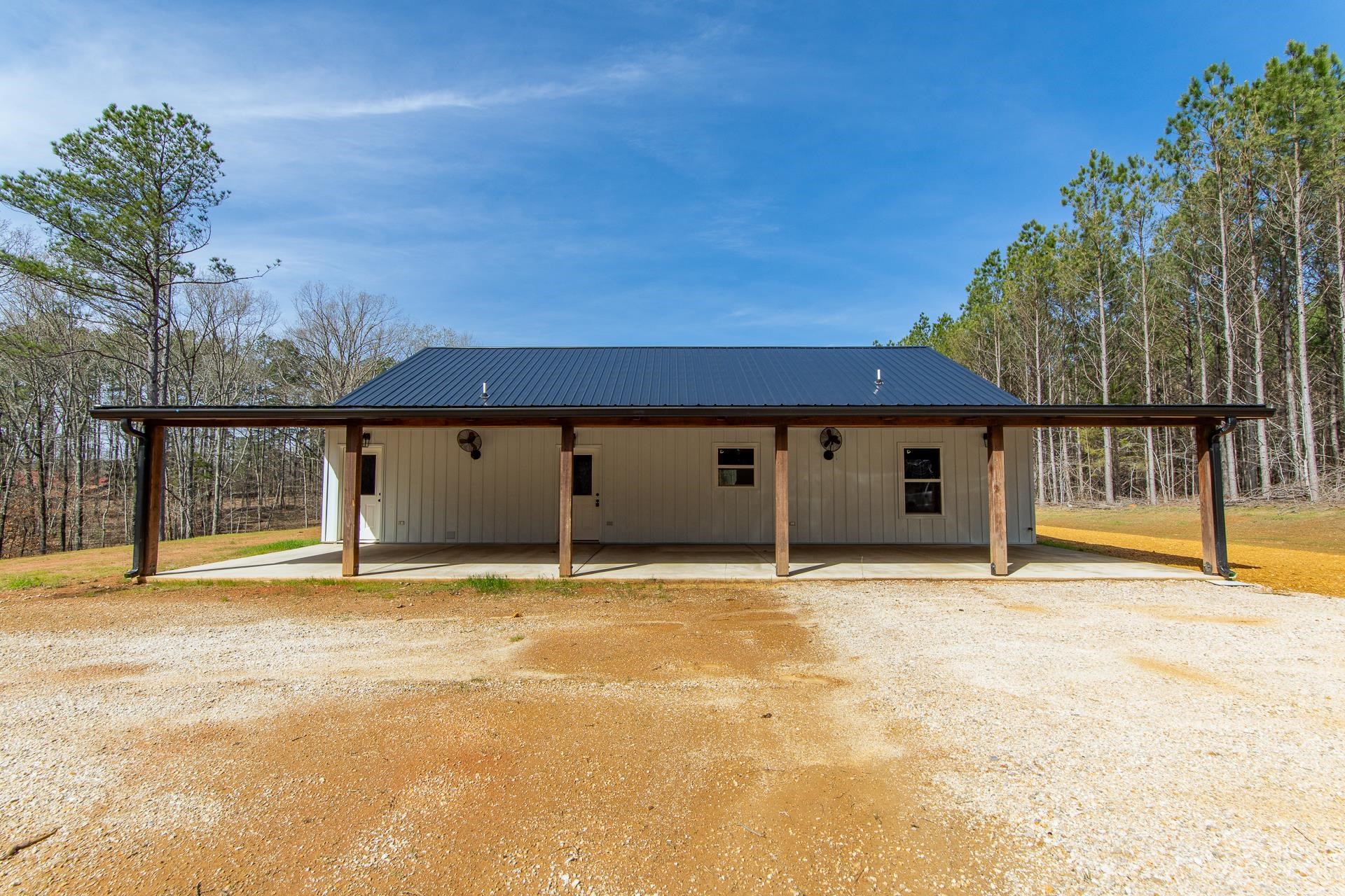1471 Chambers Store Road Michie, TN 38357 - Photo 29 of 38 View of front of property featuring driveway, a carport, and metal roof