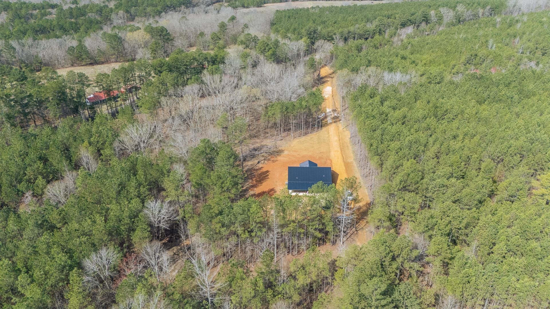 1471 Chambers Store Road Michie, TN 38357 - Photo 32 of 38 Drone / aerial view featuring a wooded view