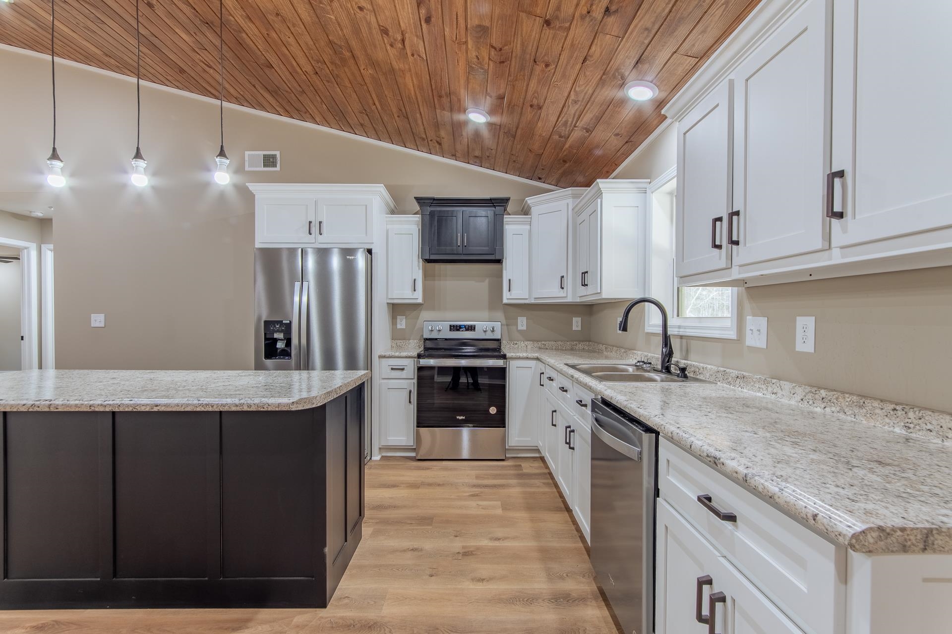 1471 Chambers Store Road Michie, TN 38357 - Photo 6 of 38 Kitchen with wood ceiling, a sink, stainless steel appliances, visible vents, and white cabinets