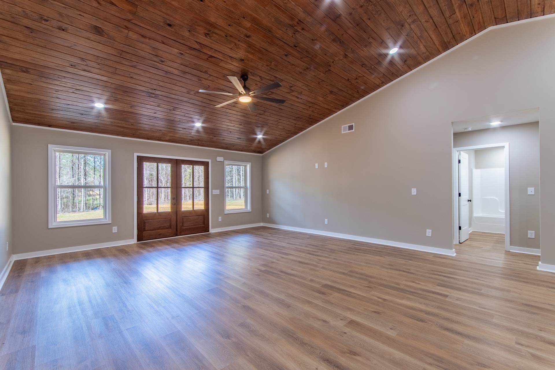1471 Chambers Store Road Michie, TN 38357 - Photo 8 of 38 Unfurnished living room featuring baseboards, ceiling fan, and wood ceiling