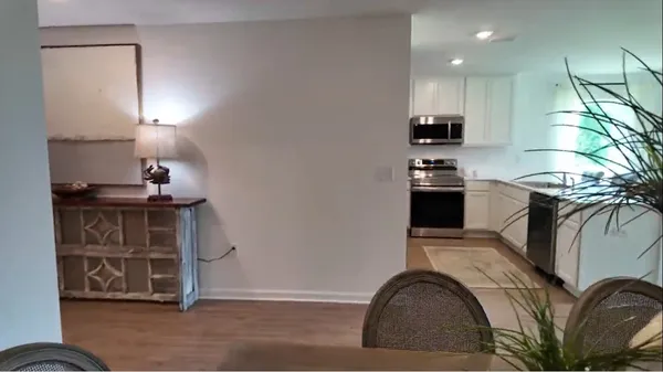 a view of a dining room with furniture and window