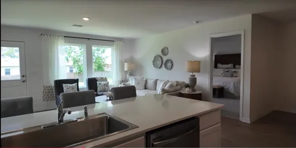 a kitchen with cabinets and stainless steel appliances