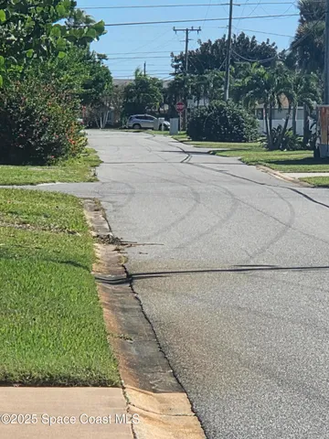 a view of empty room with window and stairs