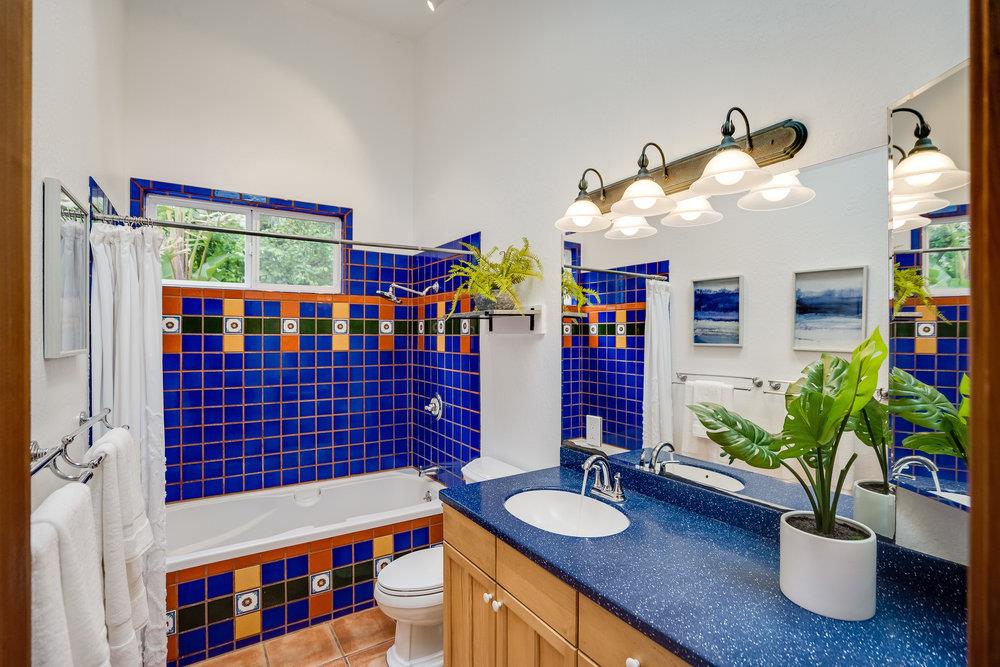 1067 Rio Vista Drive Pacifica, CA 94044 - Photo 14 of 43 a bathroom with a sink a tub and a shower