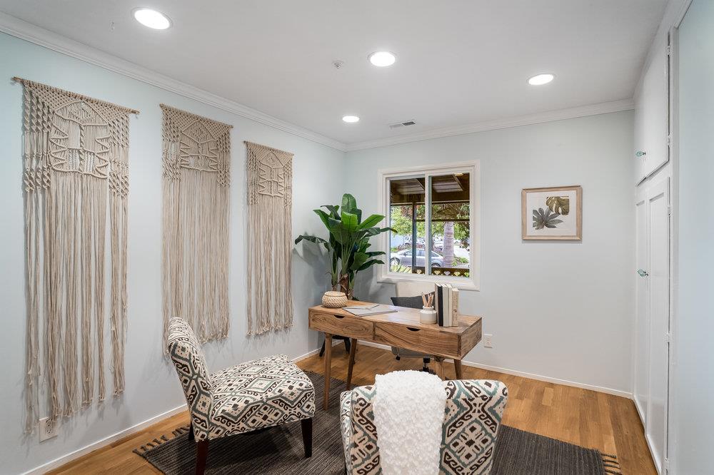 1067 Rio Vista Drive Pacifica, CA 94044 - Photo 15 of 43 a living room with furniture and a potted plant