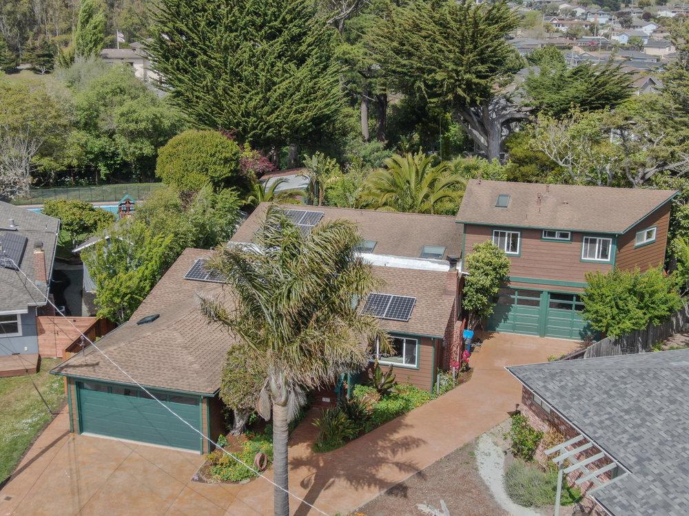 1067 Rio Vista Drive Pacifica, CA 94044 - Photo 2 of 43 an aerial view of a house with garden space and street view