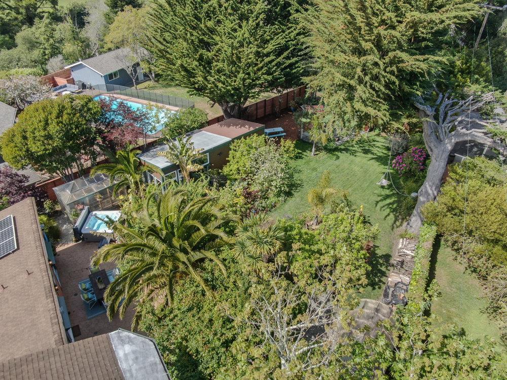 1067 Rio Vista Drive Pacifica, CA 94044 - Photo 24 of 43 a backyard of a house with a yard and outdoor seating