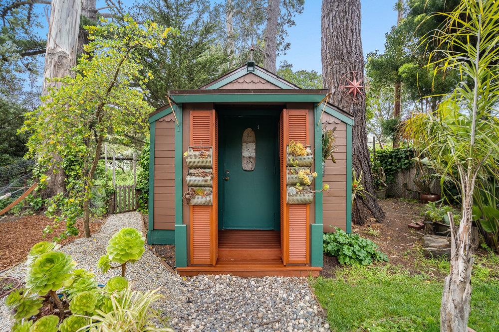 1067 Rio Vista Drive Pacifica, CA 94044 - Photo 37 of 43 a front view of a house with a yard
