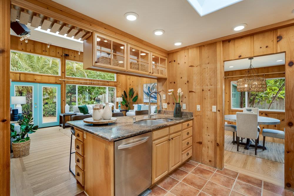1067 Rio Vista Drive Pacifica, CA 94044 - Photo 6 of 43 a kitchen with stainless steel appliances granite countertop a sink and a large window
