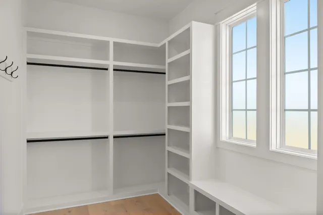 a view of a kitchen with a sink and a refrigerator