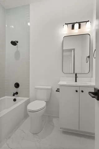 a view of a room with wooden floor and white walls