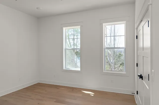 a bathroom with a double vanity sink mirror and