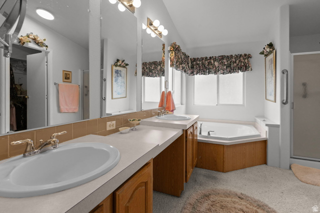 2600 North Hill Field Road, Unit 134 Layton, UT 84041 - Photo 20 of 41 Bathroom with a stall shower, a garden tub, double vanity, and lofted ceiling