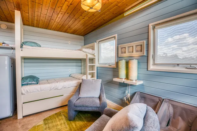 a view of a swimming pool and lounge chairs