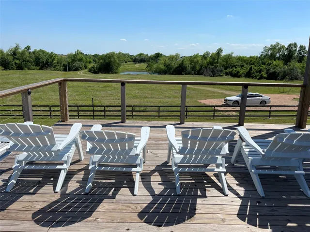 a room with water heater and wooden cabinets