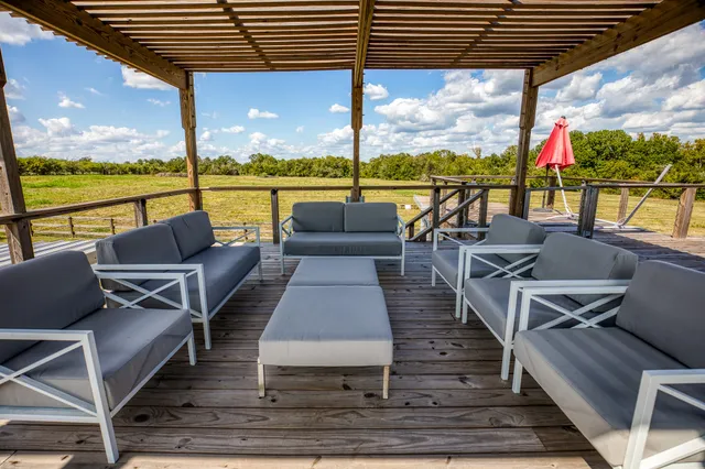 a view of lake with sunset in background