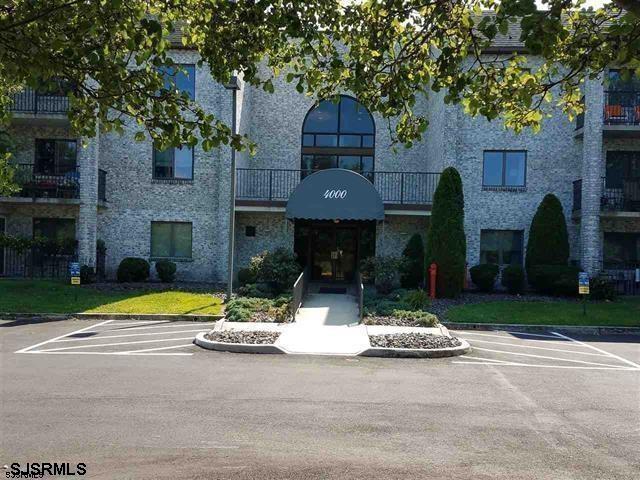 4310 Dolphin Avenue, Unit 4310 Northfield, NJ 08225 - Photo 1 of 21 a view of a house with a yard and tree s
