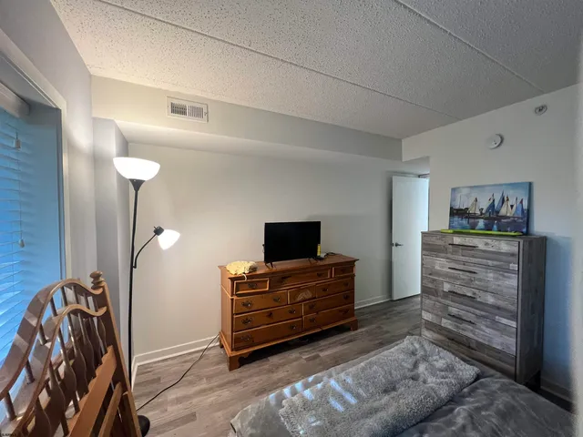 a view of bathroom with a sink and mirror