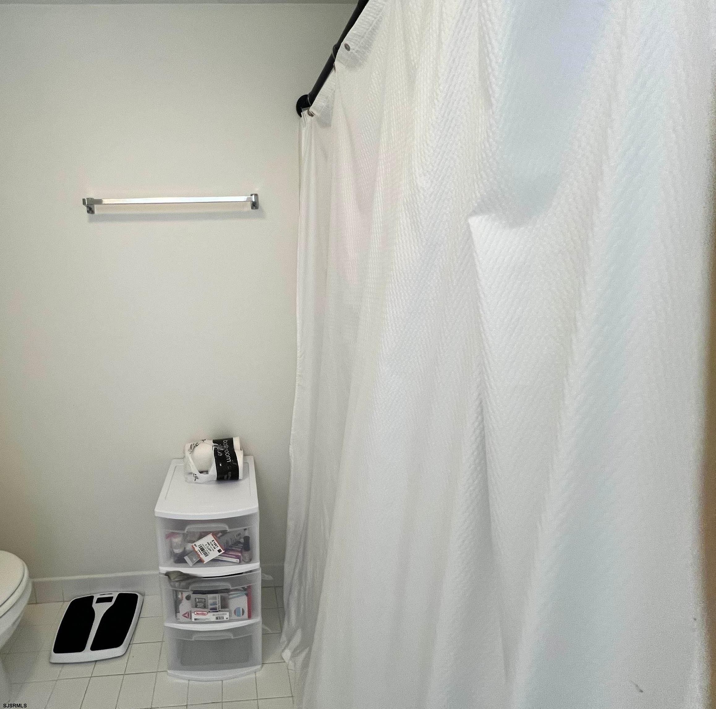 4310 Dolphin Avenue, Unit 4310 Northfield, NJ 08225 - Photo 16 of 21 a bathroom with a sink and toilet