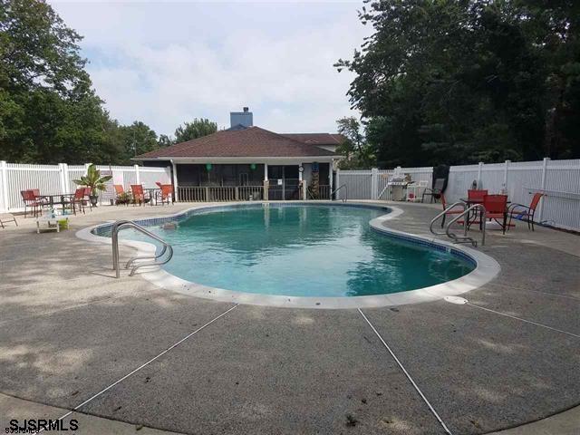 4310 Dolphin Avenue, Unit 4310 Northfield, NJ 08225 - Photo 19 of 21 a view of a house with swimming pool