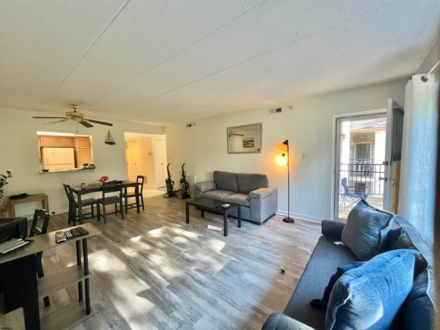 a kitchen with stainless steel appliances a refrigerator sink and cabinets