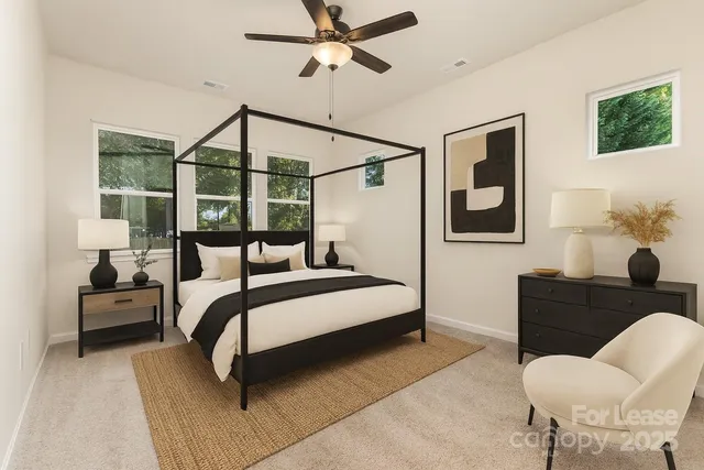 a bedroom with a bed and a couch