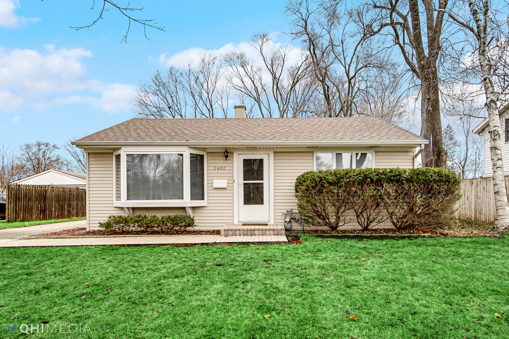 2402 Wing Street Rolling Meadows, IL 60008 - Photo 1 of 20 a front view of a house with garden