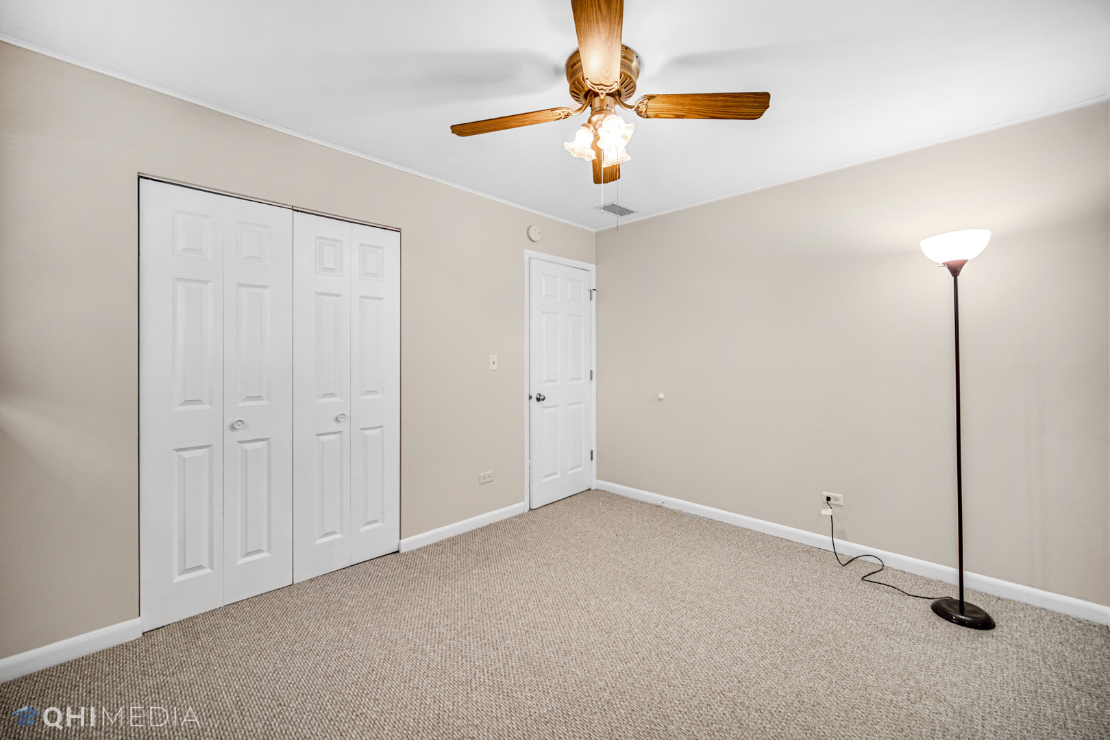 2402 Wing Street Rolling Meadows, IL 60008 - Photo 12 of 20 a view of an empty room with a chandelier fan