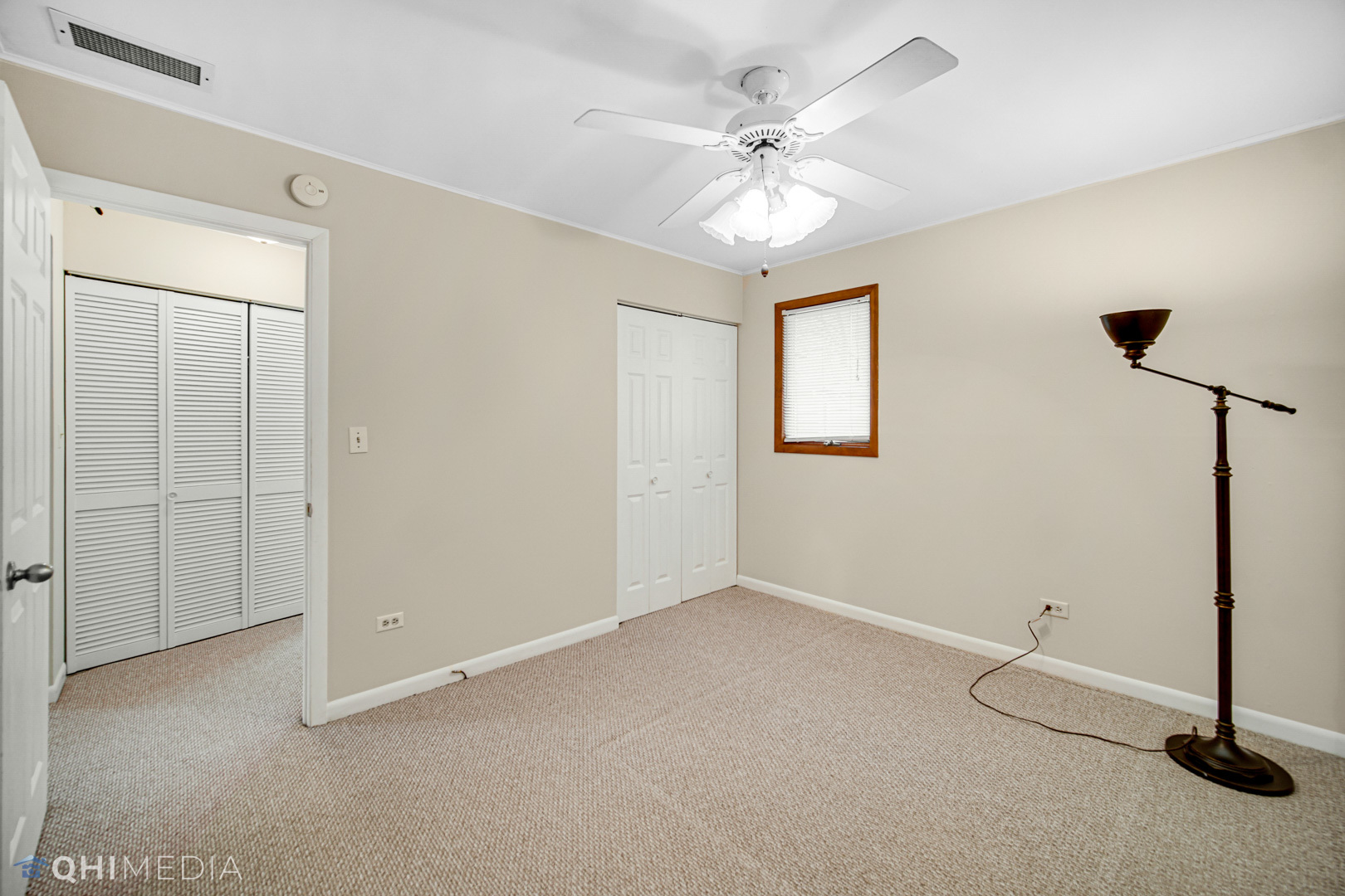 2402 Wing Street Rolling Meadows, IL 60008 - Photo 14 of 20 wooden floor in an empty room with a window