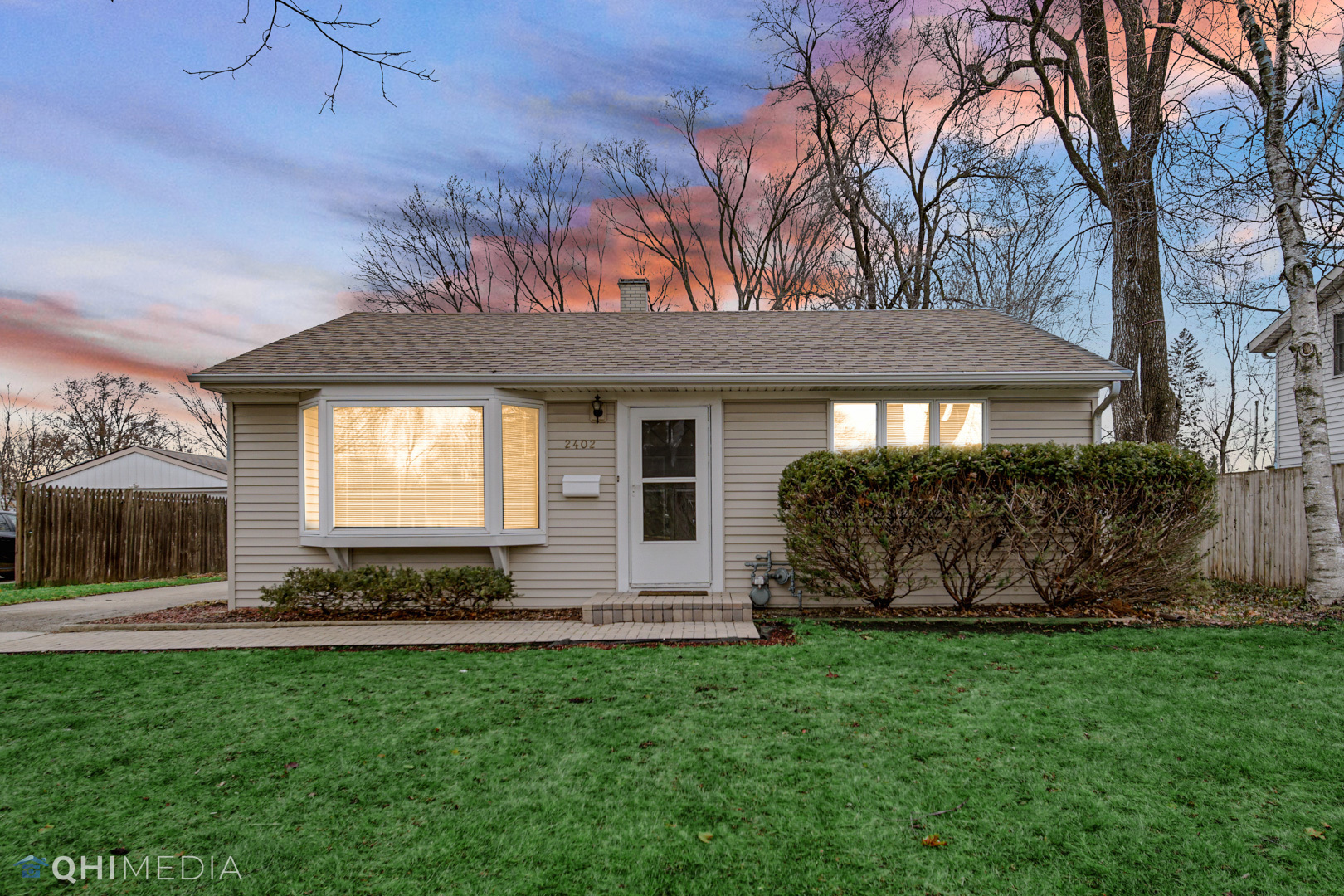 2402 Wing Street Rolling Meadows, IL 60008 - Photo 20 of 20 a front view of a house with garden