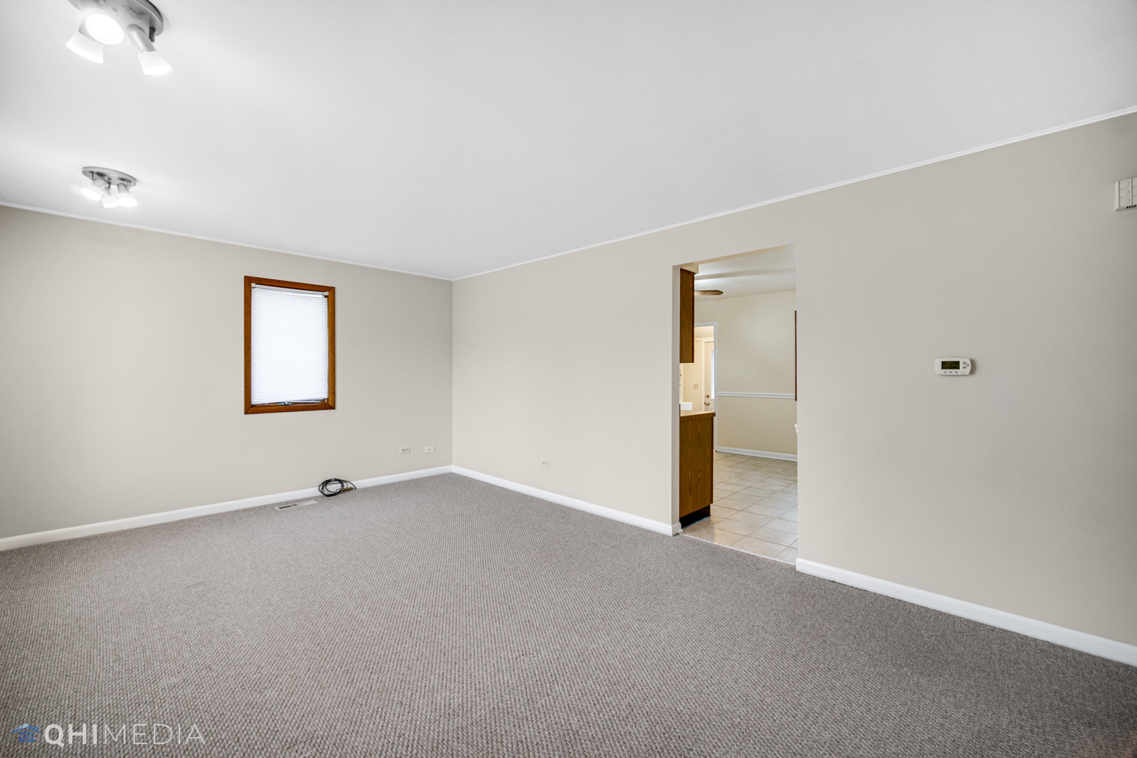 2402 Wing Street Rolling Meadows, IL 60008 - Photo 6 of 20 an empty room with a window and closet