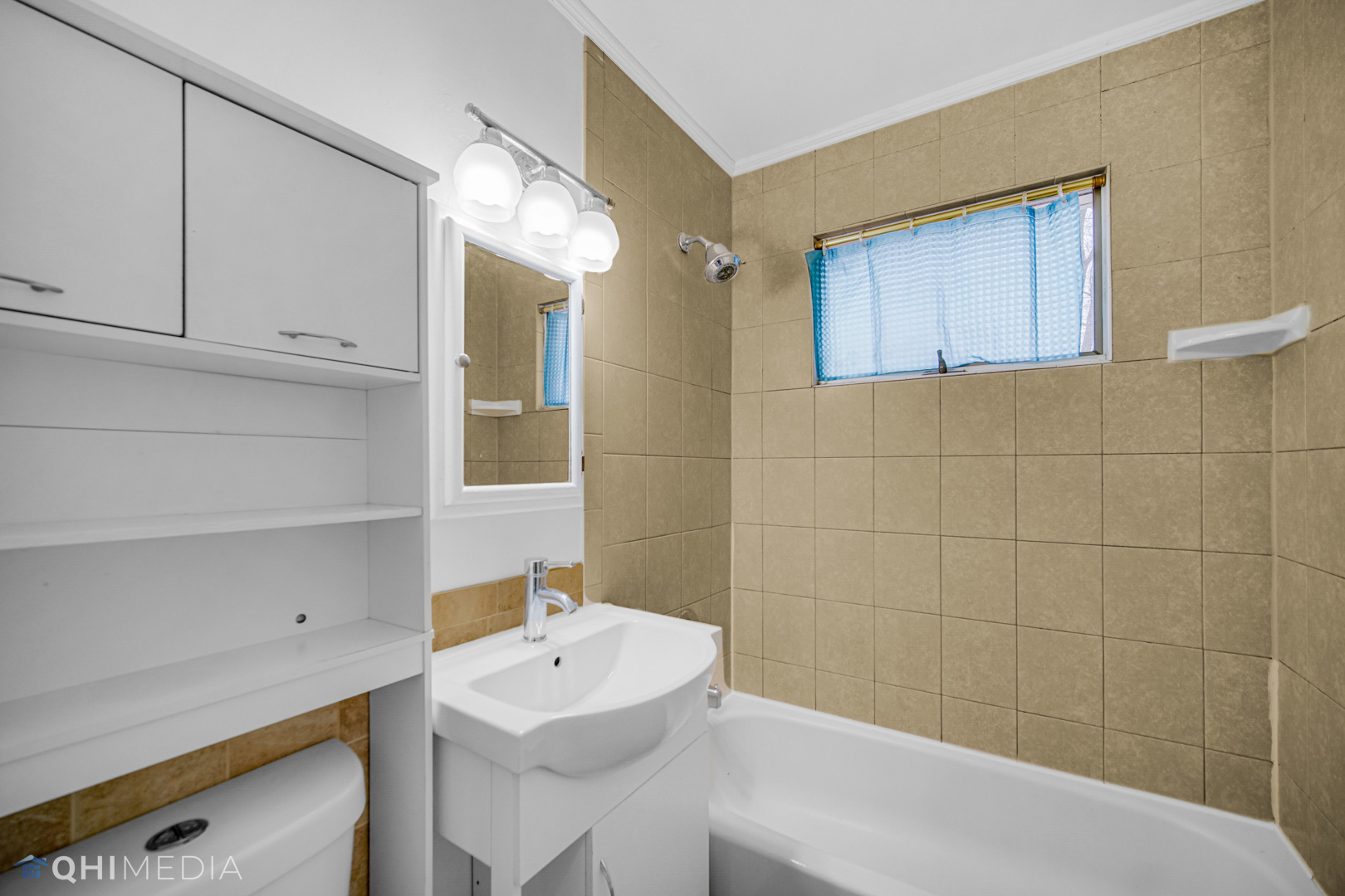 2402 Wing Street Rolling Meadows, IL 60008 - Photo 10 of 20 a bathroom with a sink a toilet and shower