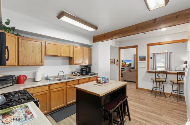 a kitchen with a table and chairs