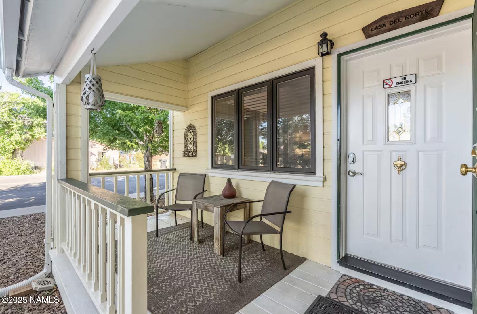 304 South 4th Street Williams, AZ 86046 - Photo 2 of 39 a front view of a house with outdoor seating