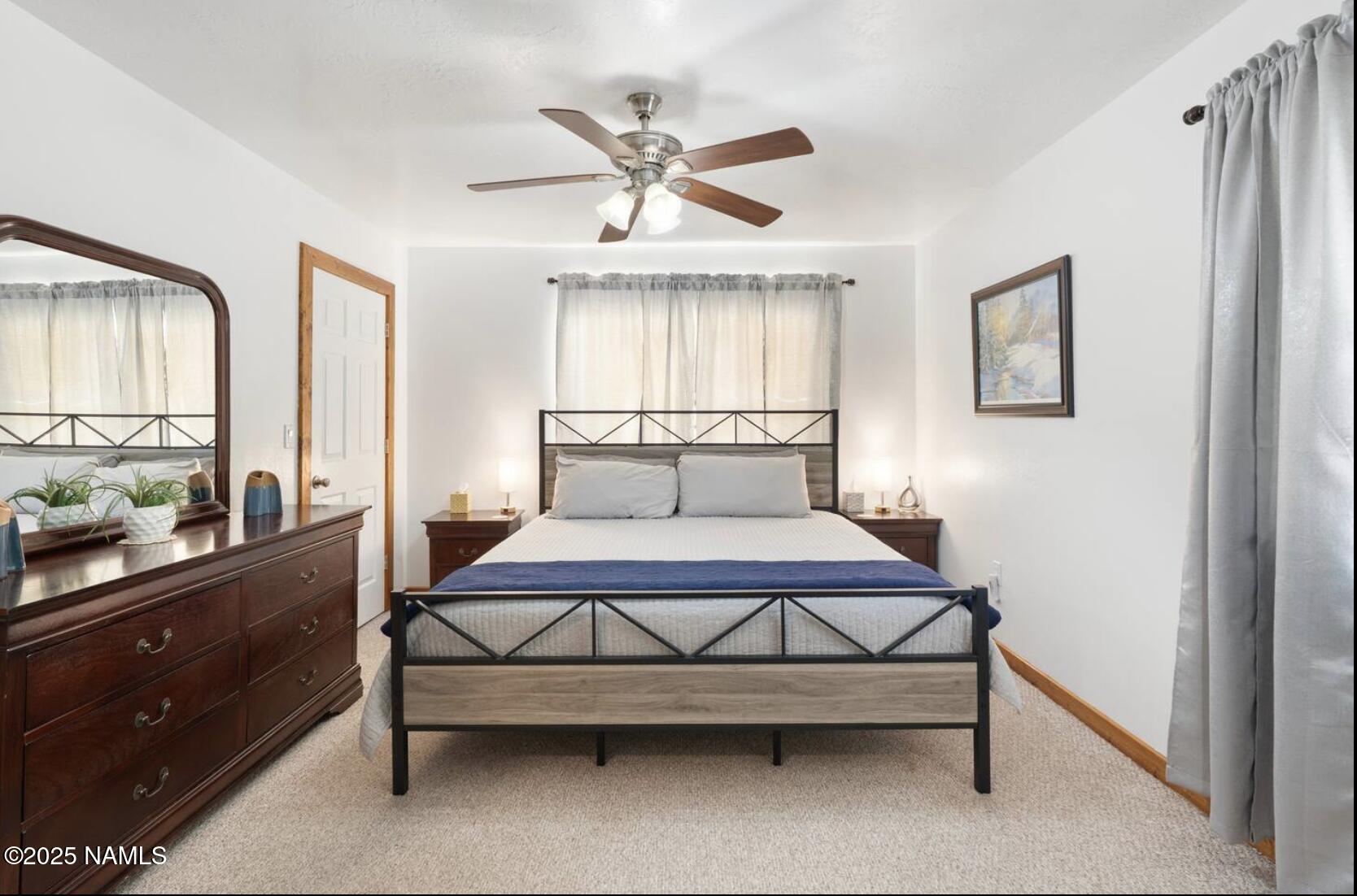 304 South 4th Street Williams, AZ 86046 - Photo 24 of 39 a bedroom with a bed and window