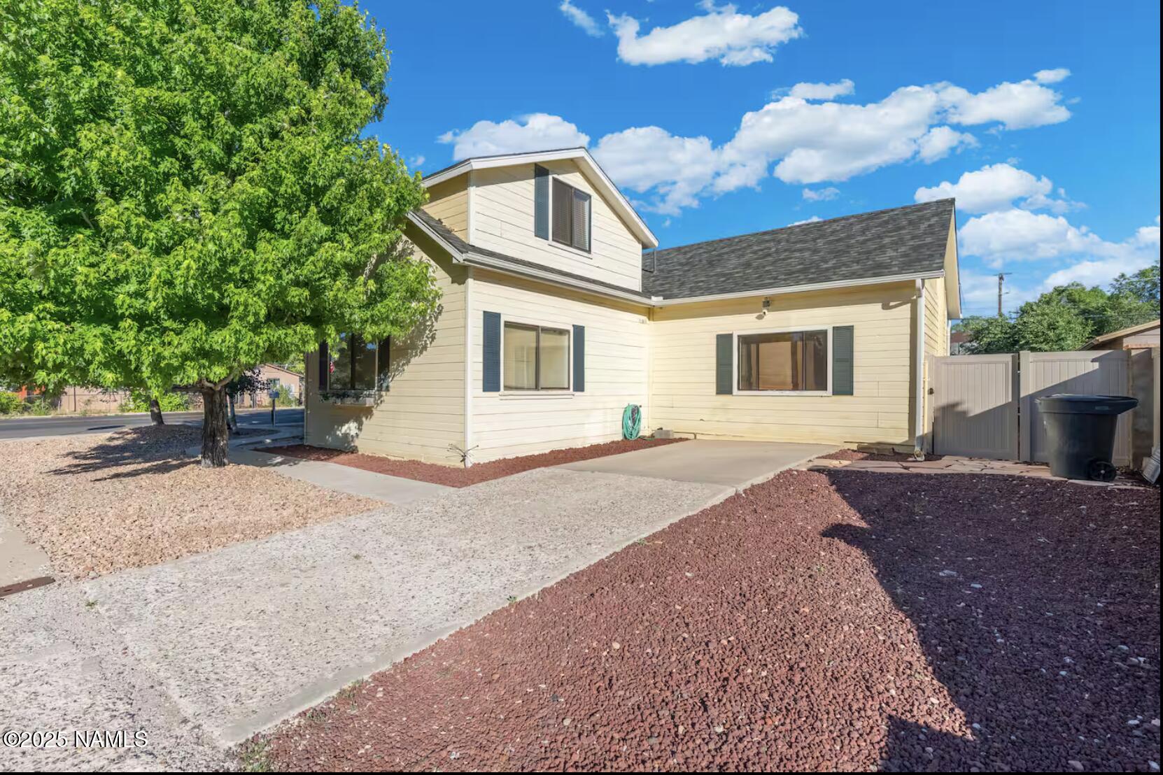 304 South 4th Street Williams, AZ 86046 - Photo 3 of 39 a front view of a house with a yard